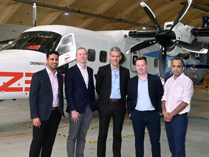 The Bank team with Zerio Avia in front of an airplane