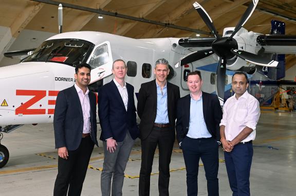 The Bank team with Zerio Avia in front of an airplane